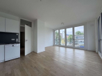 Wohnzimmer - Willkommen in der EUROPACITY! Sonnige 3-Zimmerwohnung mit Loggia und EBK