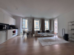 Wohnzimmer - Willkommen in der Europacity! Freundliche 2-Zimmerwohnung mit Einbauküche und Loggia